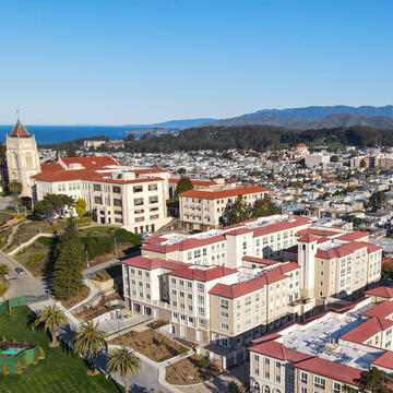 Lone Mountain Dining and Residence Hall with Golden Gate Bridge in background