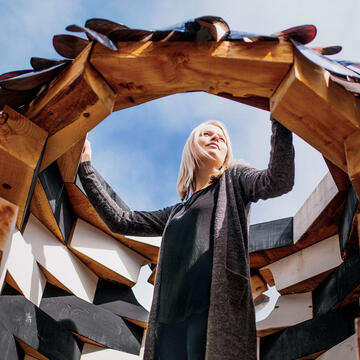 Person posing inside an art installation