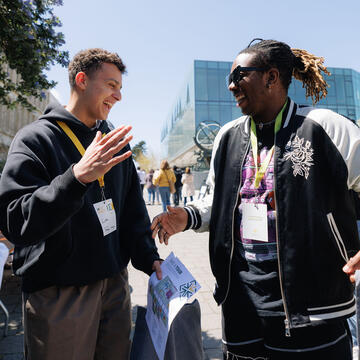 Two students greet each other at Destination USF