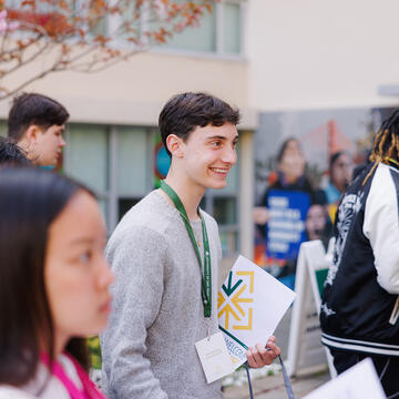 student smiling during an event