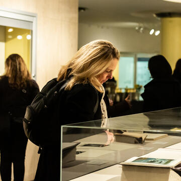 person looking at art display at the Thacher Gallery