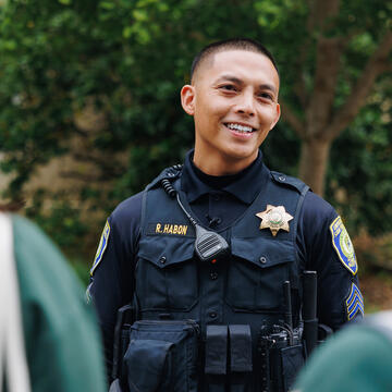 Public Safety officer speaks to students.