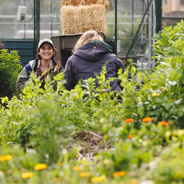 Smiling student in garden.