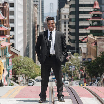 Student smiling in downtown San Francisco.