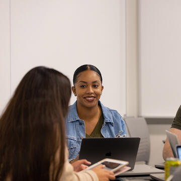 student smiles in class