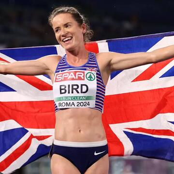 Lizzie Bird holding the United Kingdom flag