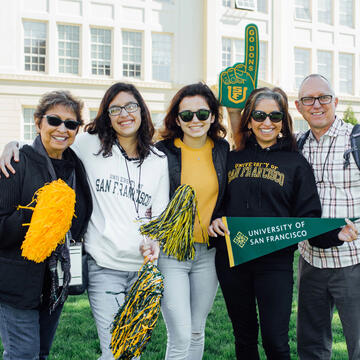 family with a lot of school spirt dropping off their daughter at USF