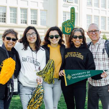 family with a lot of school spirt dropping off their daughter at USF