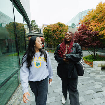 Two USF students walking together