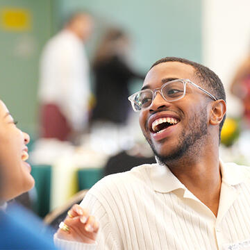 Students in Black Scholars Program laughing and chatting