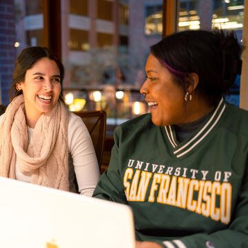 two students laugh in class