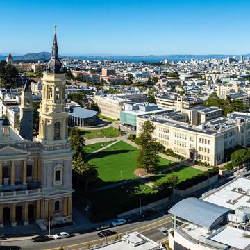Panorama image of the USF campus with downtown in the background