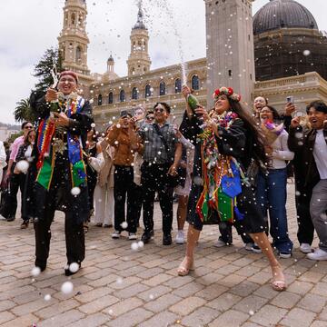 Graduates spray champagne after commencement
