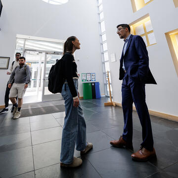student and professor speaking together at the law school