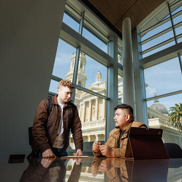 law students inside building with window in the background