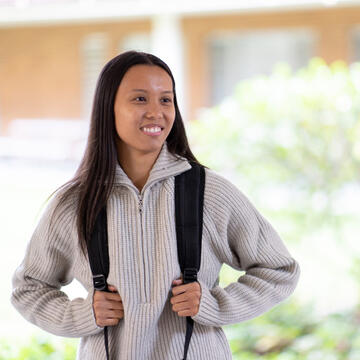 student wearing backpack outside