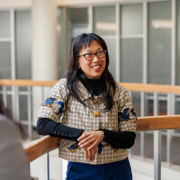 USF community member in SOL building smiling
