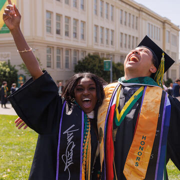 Two graduates celebrate