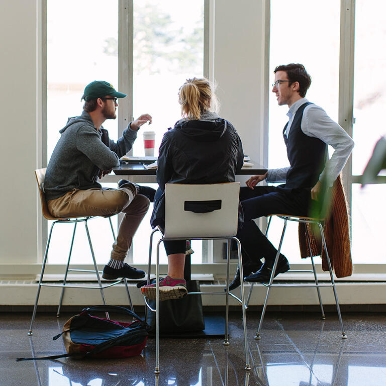 students sit together and eat