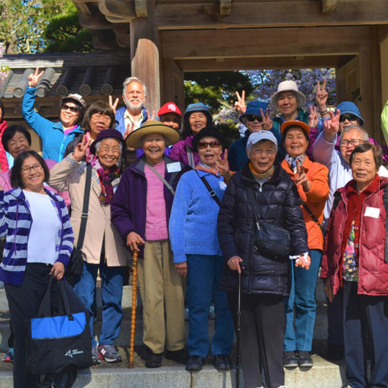 A group of seniors posing for a photo outdoors