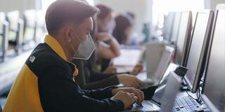 Students work in a computer lab