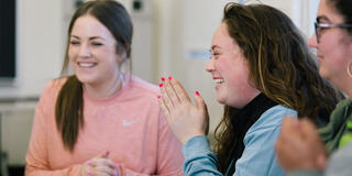 Students laughing in classroom