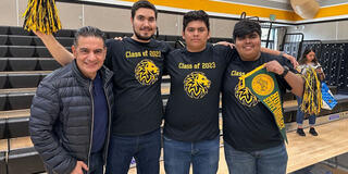 Salvador Chavez posing with high school students