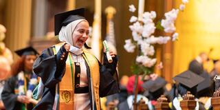 graduating student walking down church aisle