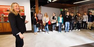 Christina Garvey talking to a group of students at Fastly
