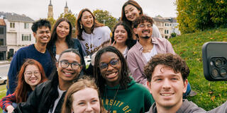 Group of students poses for a selfie.