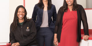 Associate Dean Colette Cann, Dean Shabnam Koirala-Azad and Associate Dean Cheryl Jones-Walker smiling towards the camera  