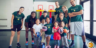 Dons basketball players coach typical- and special-needs kids at War Memorial Gymnasium.