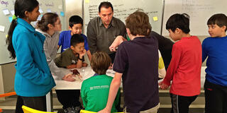 USF Math Professor Paul Zeitz works with math students