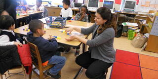 First-year USF School of Education students working in the classroom under the guidance of experienced mentor teachers