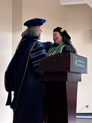 Michelle Concepcion receiving Dean's Medal for Promoting Professionalism