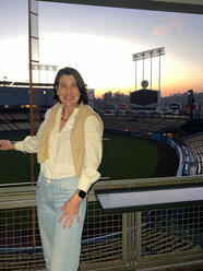 Sara Gotfredson posing in front of a stadium